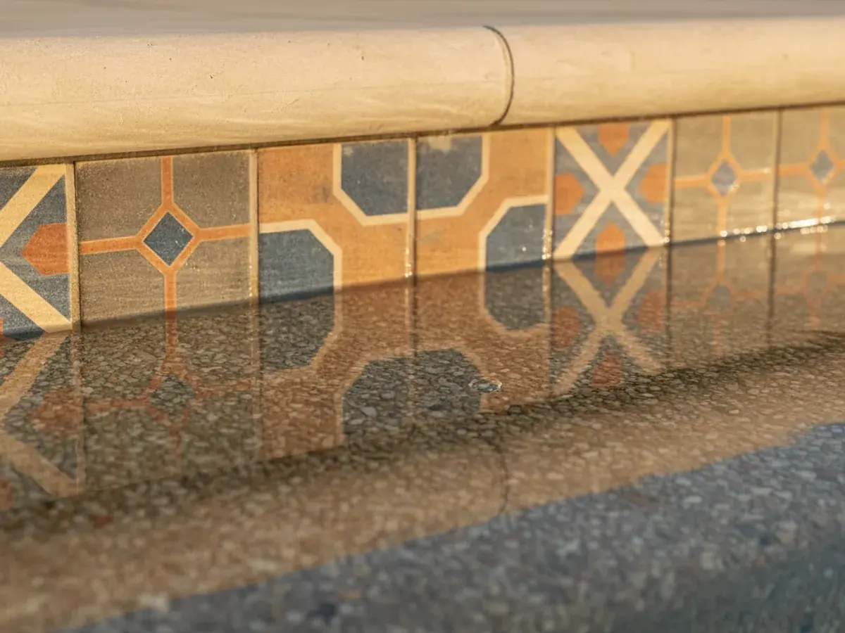 Resurfacing detail work by a San Diego County pool technician